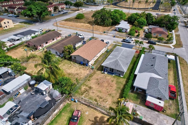 birds eye view of property with a residential view