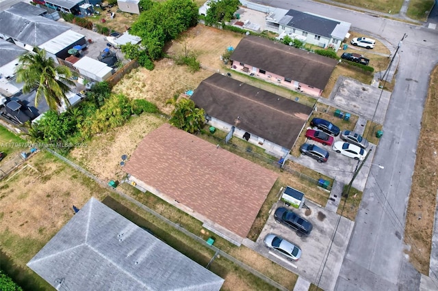 birds eye view of property with a residential view
