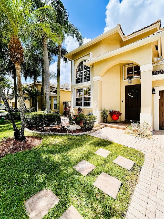 16541 Turquoise Trl, Weston, FL 33331 - view of front of house with stucco siding and a front yard