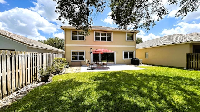 16541 Turquoise Trl, Weston, FL 33331 - back of property with stucco siding, a fenced backyard, a patio, and a tile roof