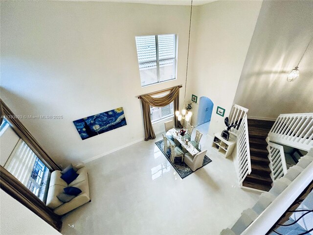16541 Turquoise Trl, Weston, FL 33331 - living room featuring baseboards and a towering ceiling