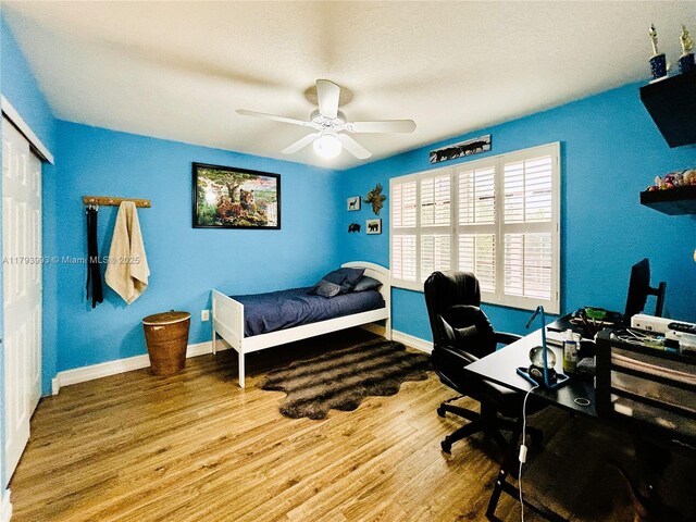 16541 Turquoise Trl, Weston, FL 33331 - bedroom featuring a desk, wood finished floors, ceiling fan, and a closet