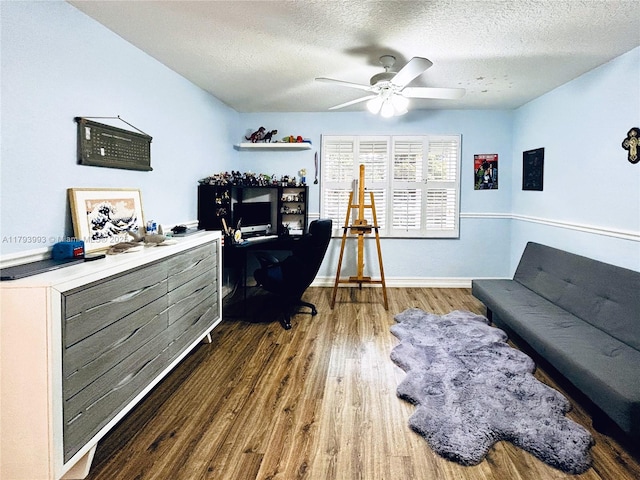16541 Turquoise Trl, Weston, FL 33331 - home office with wood finished floors, a textured ceiling, and a ceiling fan