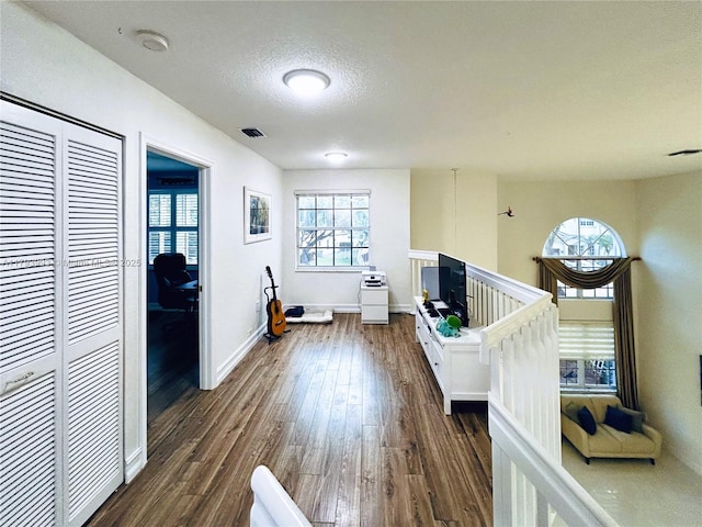 16541 Turquoise Trl, Weston, FL 33331 - hall featuring dark wood finished floors and a textured ceiling