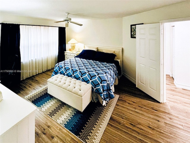 16541 Turquoise Trl, Weston, FL 33331 - bedroom with wood finished floors and ceiling fan
