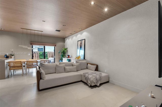living area with visible vents, recessed lighting, and wooden ceiling