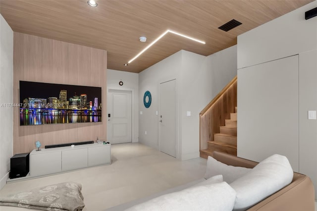 living room with visible vents and stairs