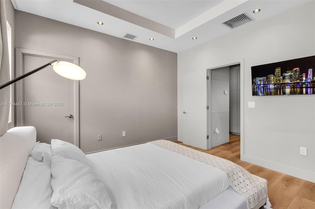 bedroom featuring visible vents, recessed lighting, and light wood-type flooring