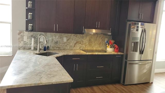 7310 NW 17th Ct, Pembroke Pines, FL 33024 - kitchen with stainless steel fridge with ice dispenser, a sink, under cabinet range hood, open shelves, and tasteful backsplash