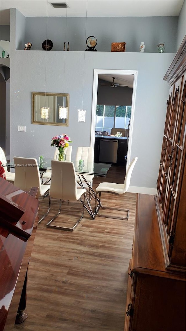 7310 NW 17th Ct, Pembroke Pines, FL 33024 - dining room with wood finished floors, a ceiling fan, and baseboards