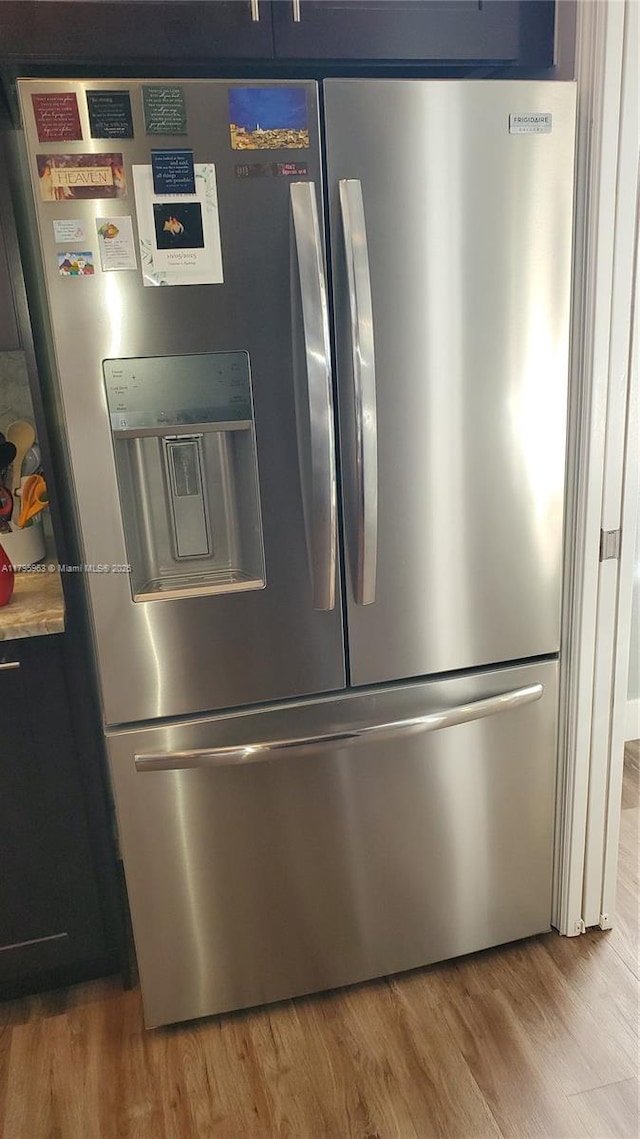7310 NW 17th Ct, Pembroke Pines, FL 33024 - kitchen view of stainless steel fridge and wood finished floors