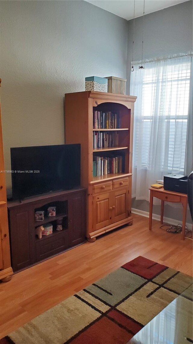 7310 NW 17th Ct, Pembroke Pines, FL 33024 - living area featuring wood finished floors