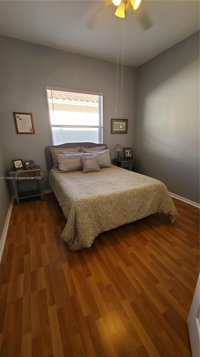 7310 NW 17th Ct, Pembroke Pines, FL 33024 - bedroom with wood finished floors, baseboards, and a ceiling fan