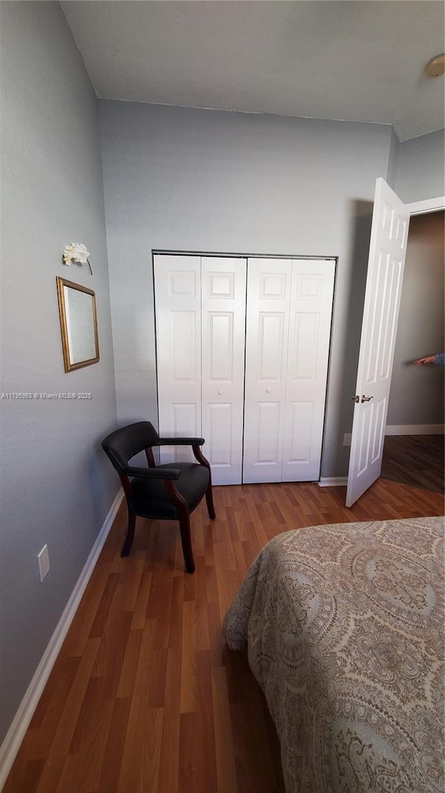 7310 NW 17th Ct, Pembroke Pines, FL 33024 - bedroom featuring wood finished floors, baseboards, and a closet