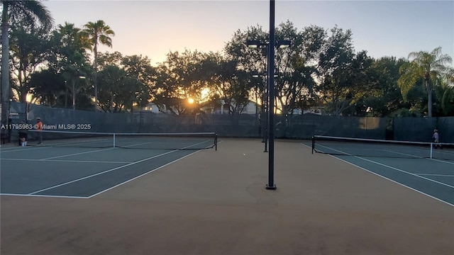 7310 NW 17th Ct, Pembroke Pines, FL 33024 - view of tennis court with community basketball court and fence