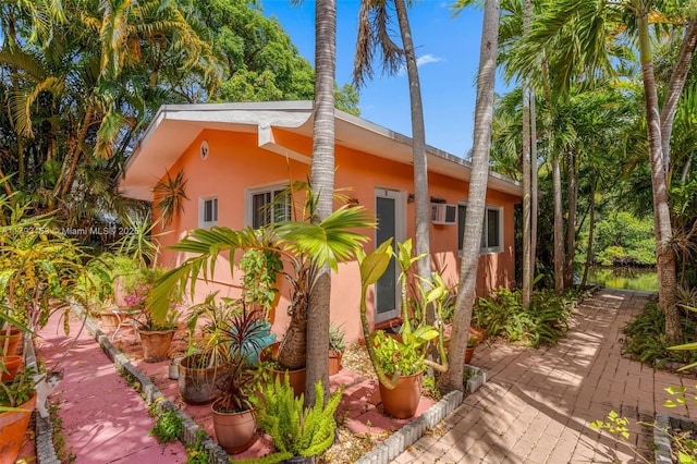 view of home's exterior with a patio and stucco siding