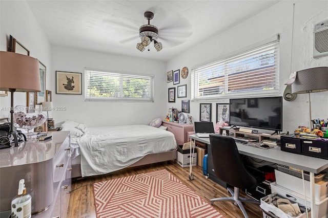 bedroom featuring ceiling fan and wood finished floors