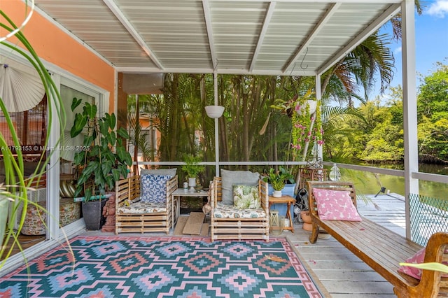 sunroom featuring plenty of natural light and an outdoor hangout area