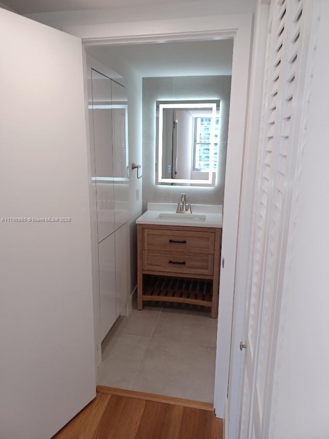 bathroom with vanity and wood finished floors