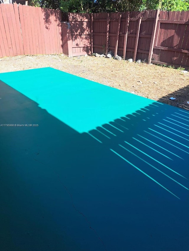 view of pool with fence