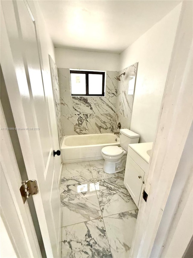 full bathroom with vanity, marble finish floor, toilet, and shower / washtub combination