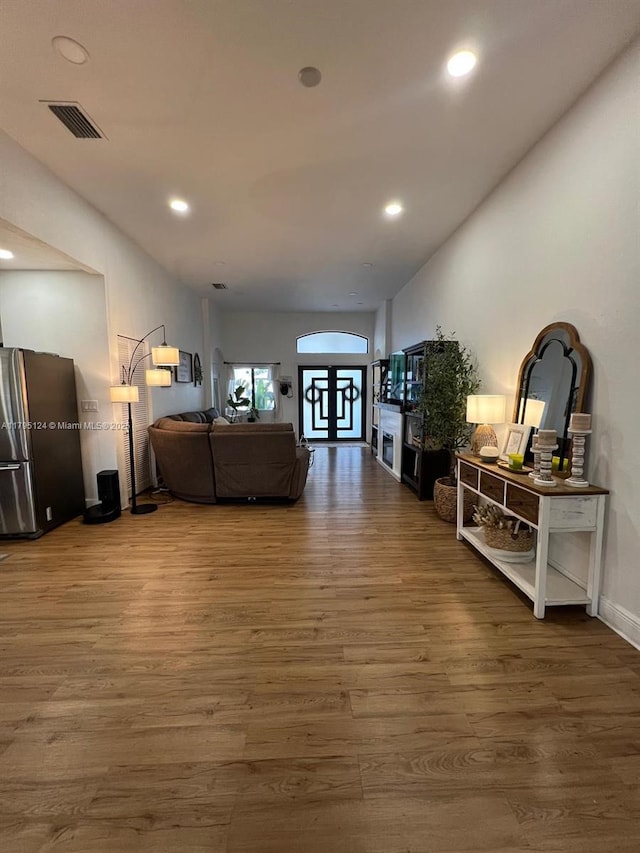 interior space with recessed lighting, visible vents, and wood finished floors
