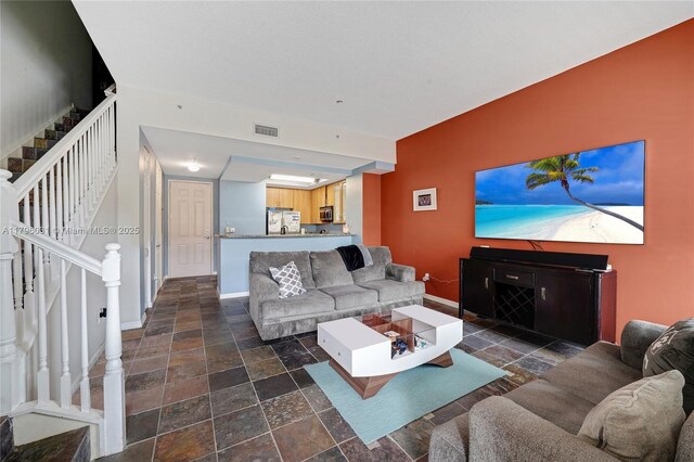 2633 NE 14th Ave Unit 110, Wilton Manors, FL 33334 - hallway featuring baseboards and dark colored carpet