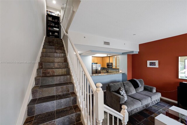 2633 NE 14th Ave Unit 110, Wilton Manors, FL 33334 - bathroom featuring toilet, baseboards, and tile patterned floors