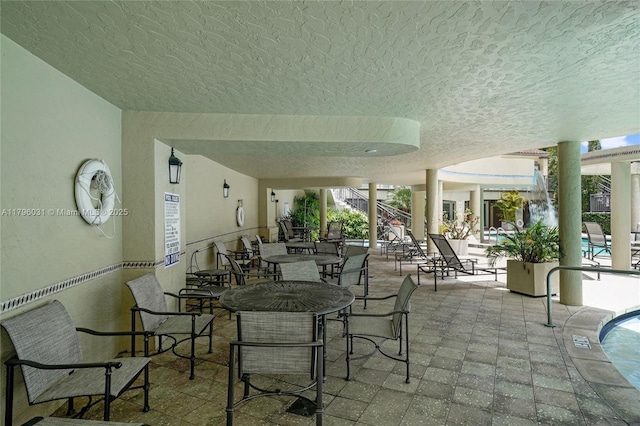 view of patio / terrace featuring a community pool