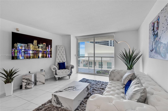 1200 Brickell Bay Dr Unit 2807, Miami, FL 33131 - living area featuring a wall of windows and a textured ceiling