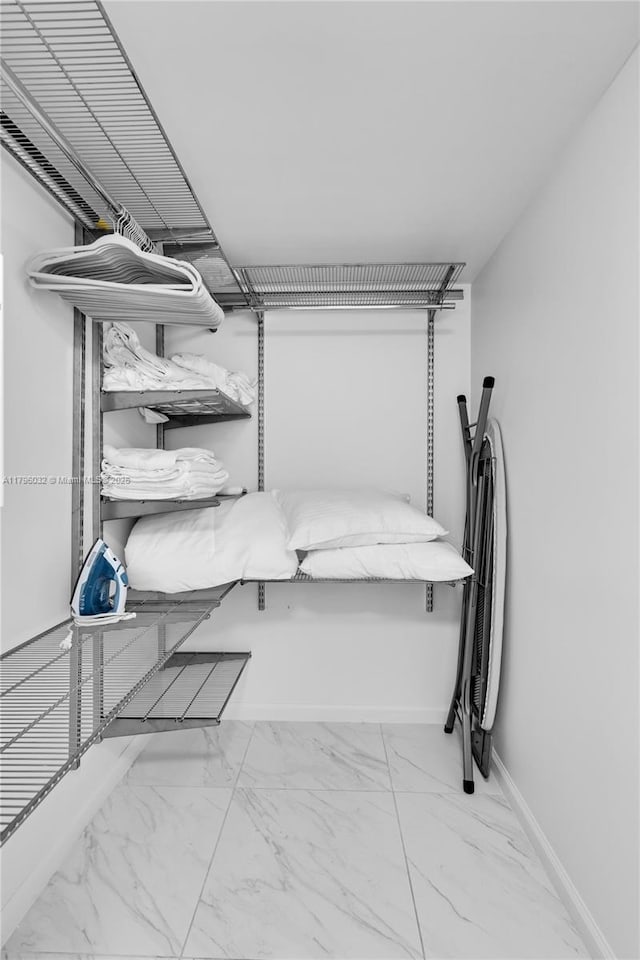 1200 Brickell Bay Dr Unit 2807, Miami, FL 33131 - walk in closet featuring marble finish floor