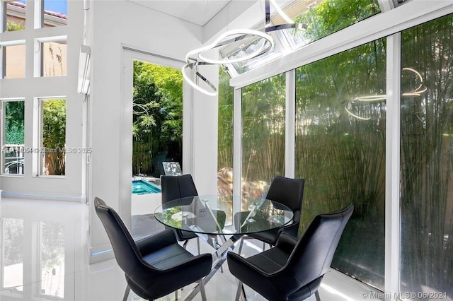 sunroom with an inviting chandelier