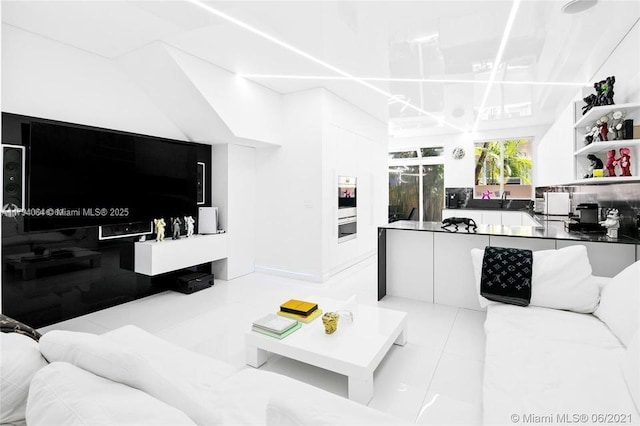 living area featuring tile patterned flooring