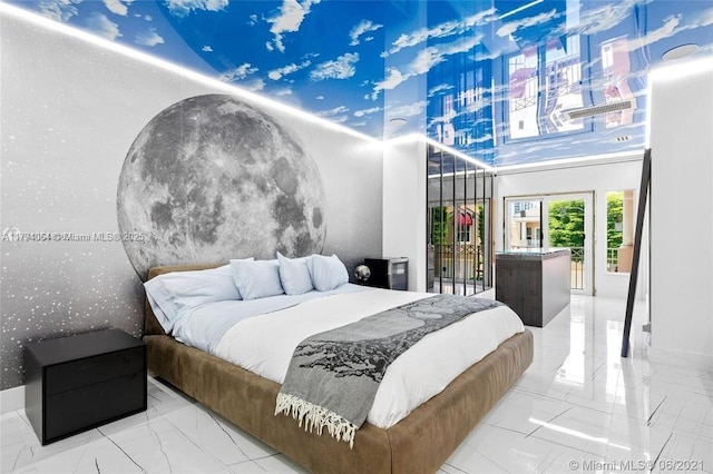 bedroom with access to outside and marble finish floor
