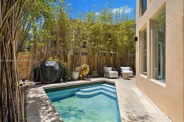 3710 NE 208th Ter, Aventura, FL 33180 - view of swimming pool featuring a fenced backyard, area for grilling, and a patio