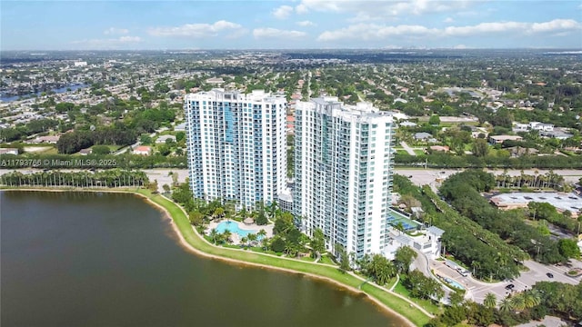 birds eye view of property with a water view