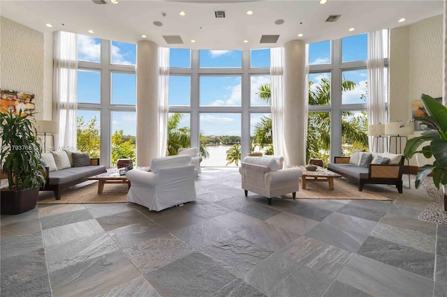 lobby featuring a water view and visible vents