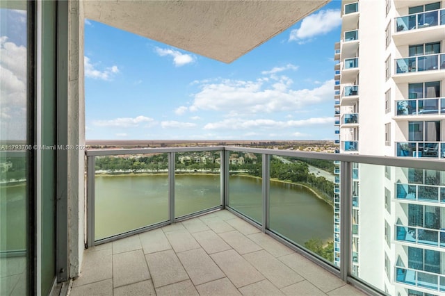balcony featuring a water view