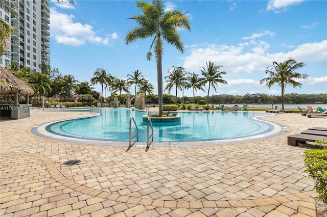 community pool with a patio area