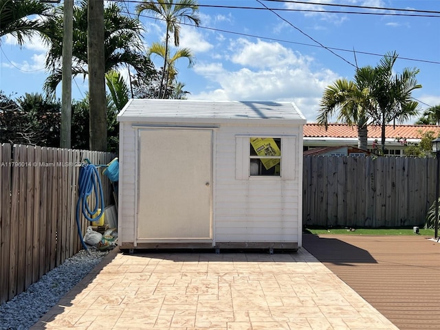 view of shed with a fenced backyard