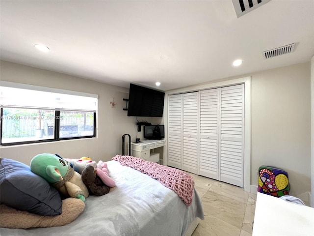 bedroom with visible vents, recessed lighting, marble finish floor, and a closet