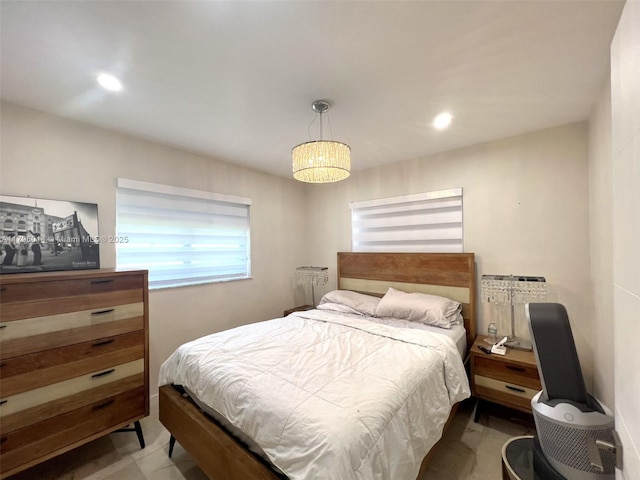 bedroom featuring recessed lighting and radiator