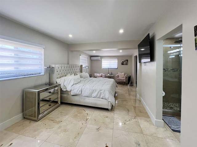 bedroom featuring marble finish floor, baseboards, a wall mounted air conditioner, recessed lighting, and ensuite bath