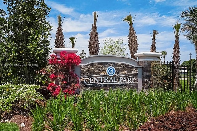 community sign with fence