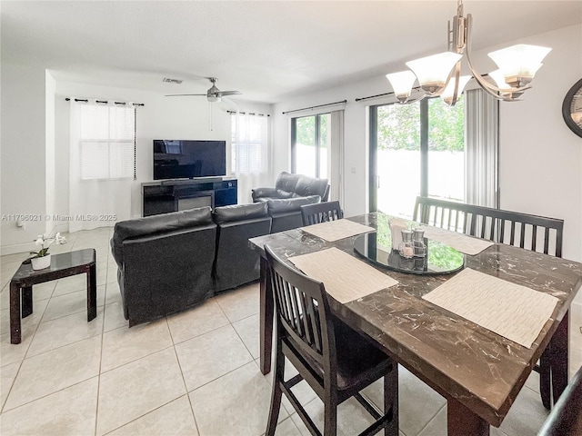 4723 NW 59th St, Tamarac, FL 33319 - dining space with ceiling fan with notable chandelier, light tile patterned flooring, and visible vents