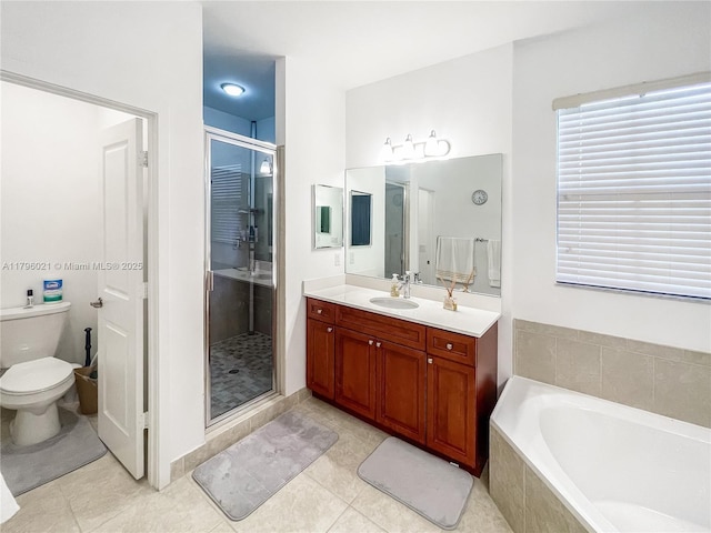 full bath featuring vanity, a bath, a stall shower, and toilet