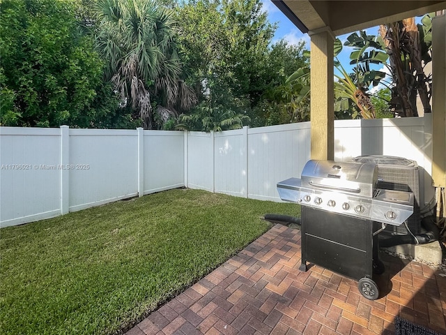 view of patio with a fenced backyard and grilling area