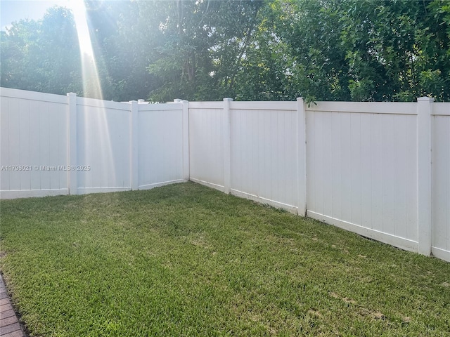 view of yard featuring fence