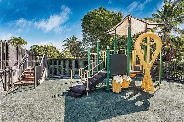 community jungle gym featuring fence