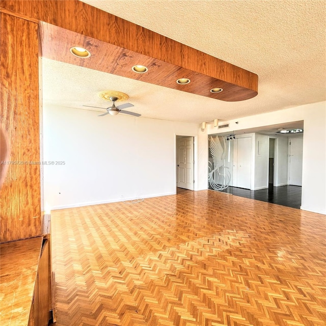 unfurnished room featuring ceiling fan, a textured ceiling, recessed lighting, baseboards, and visible vents